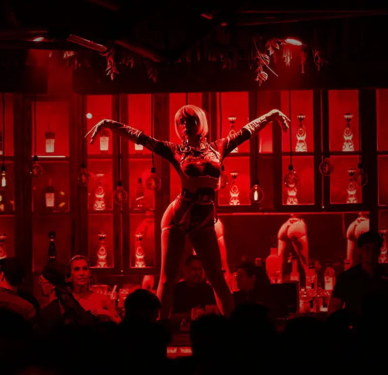 Live show performer on the bar at Mandala Cancun